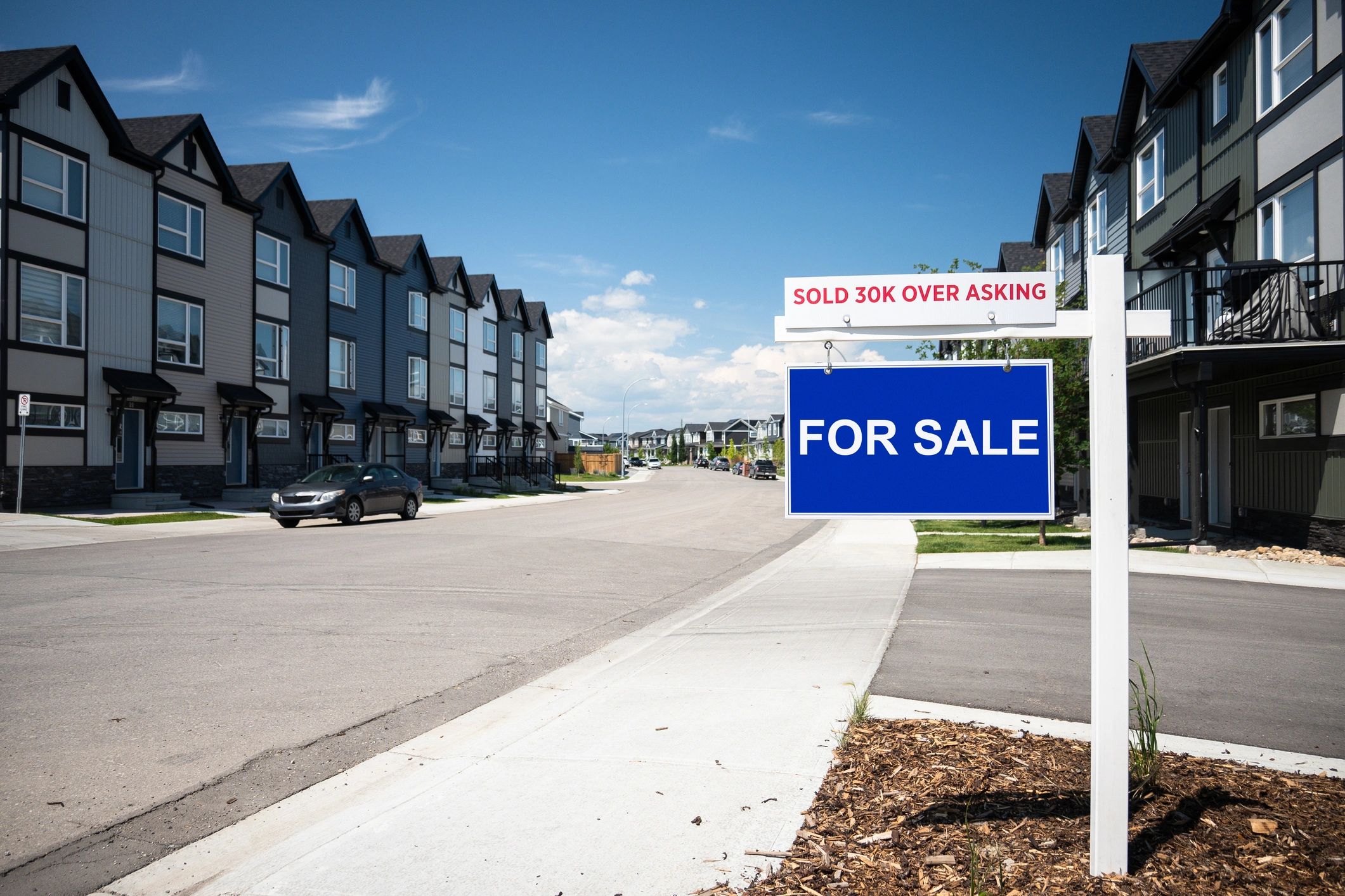 For sale sign in a residential neighborhood
