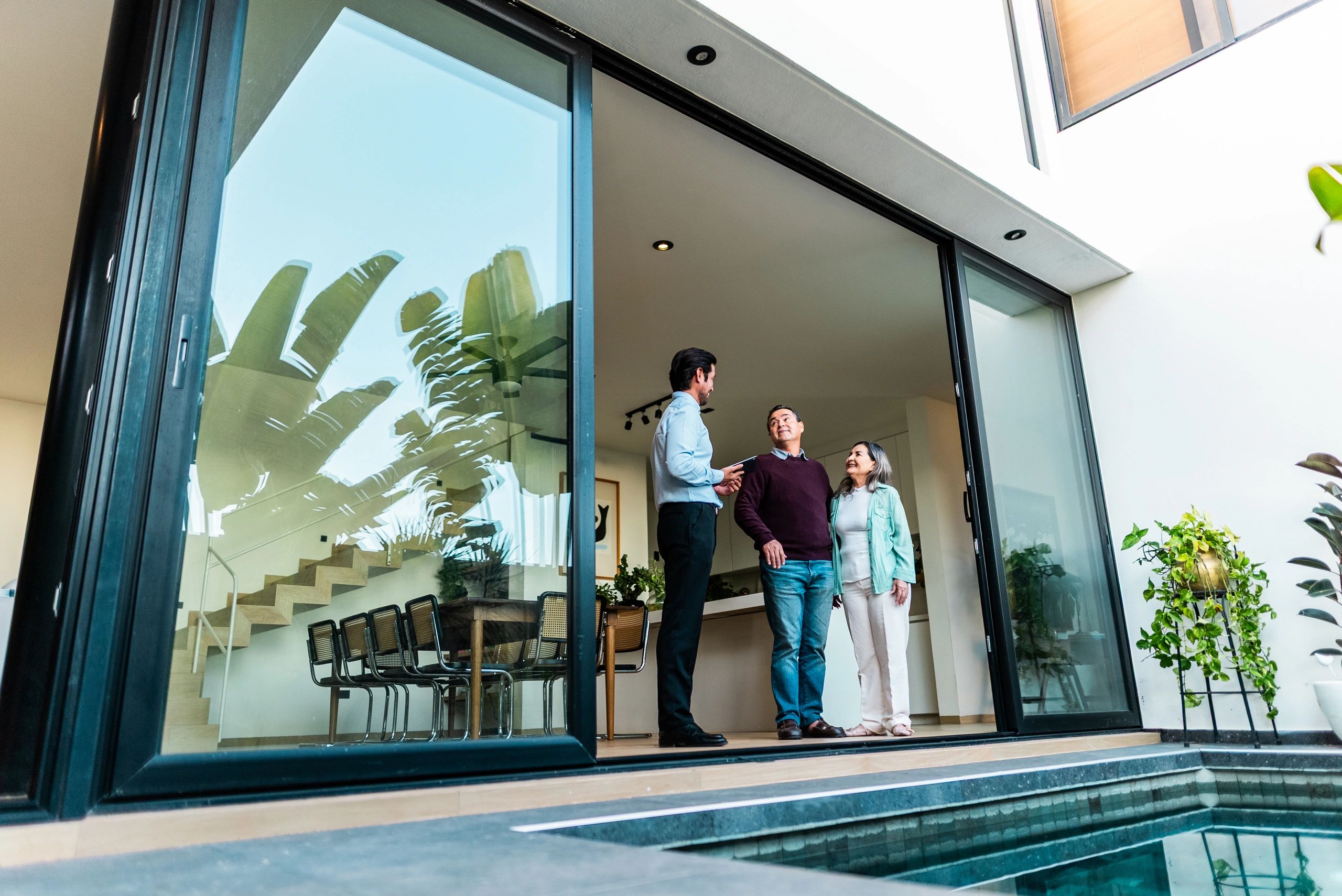 Happy homebuyers with their real estate agent