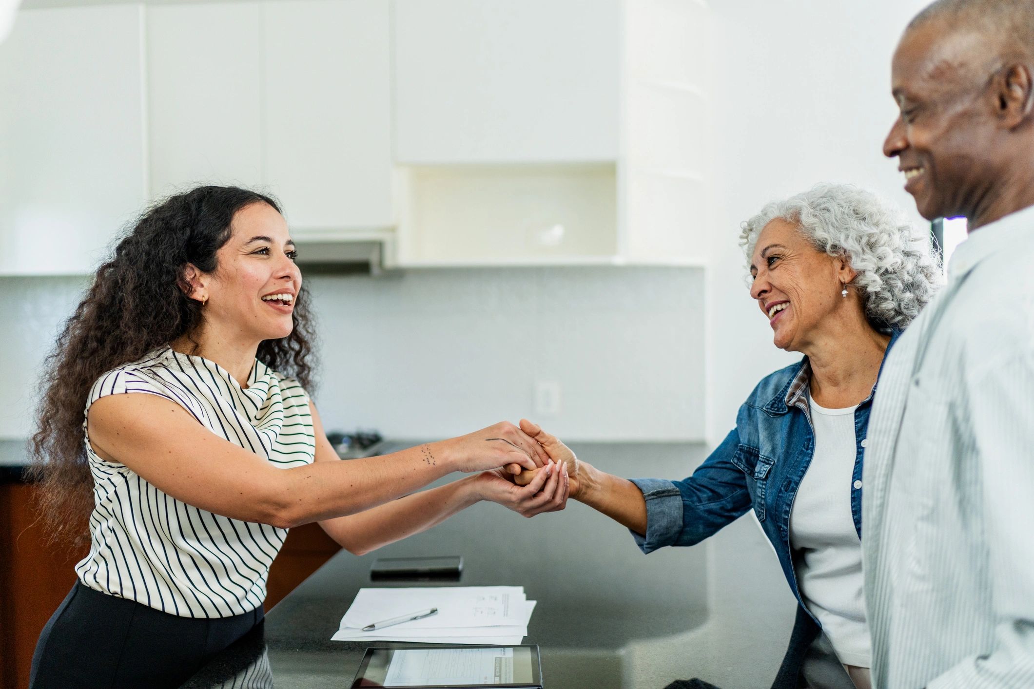 Agent meeting with home buyers during a real estate consultation